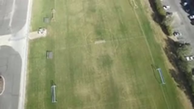 HIDDEN LAKE COLORADO-2016: Aerial View Of A Grassy Green Field And A Road Nearby