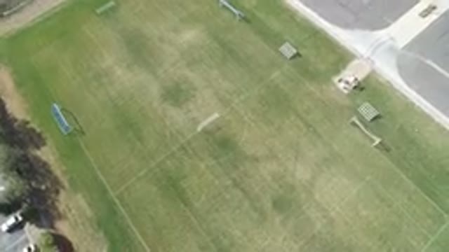 HIDDEN LAKE COLORADO-2016: Birds Eye View On A Grass Soccer Field Near A Parking