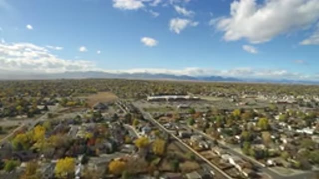 HIDDEN LAKE COLORADO-2016: Aerial View Of A City With Houses And Trees With Mountains