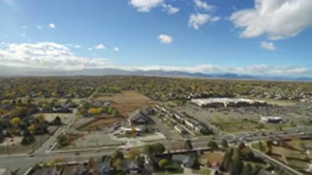 HIDDEN LAKE COLORADO-2016: Aerial View Of Over A City With Traffic On A Sunny