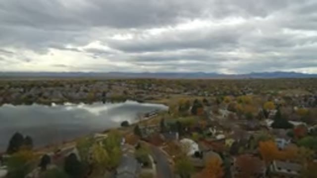 HIDDEN LAKE COLORADO-2016: Aerial View Of A City With Many Green Trees And
