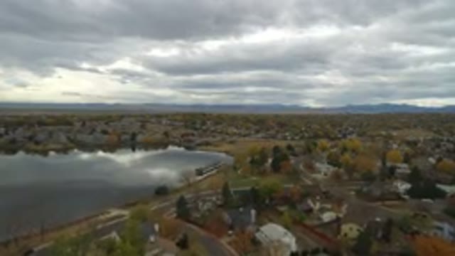 HIDDEN LAKE COLORADO-2016: Aerial View Panning Across The Suburbs Of A Treed