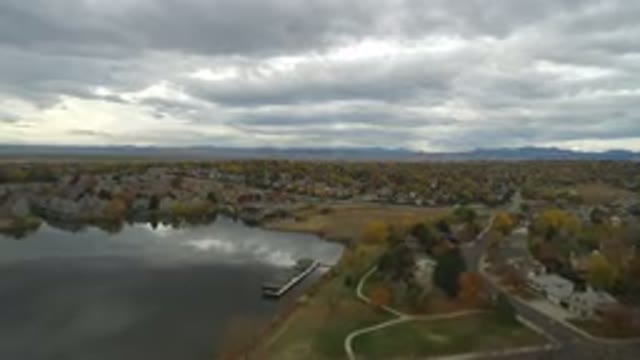 HIDDEN LAKE COLORADO-2016: Drone Flying Over Lake On Cloudy Day