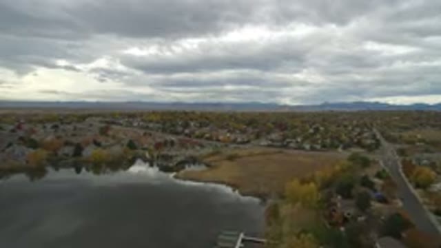 HIDDEN LAKE COLORADO-2016: Aerial View Of A Green Forest And A Lake With