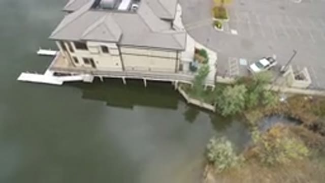 HIDDEN LAKE COLORADO-2016: Aerial View Of A House Near A Lake And A Car In The