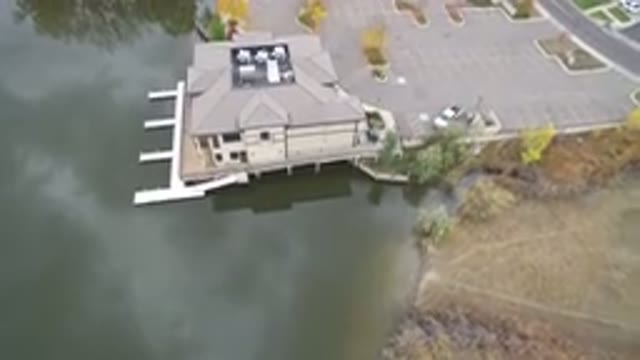 HIDDEN LAKE COLORADO-2016: Aerial View Of A House Next To A Sea And A Road