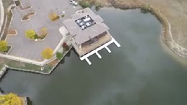 HIDDEN LAKE COLORADO-2016: Aerial View Of A House Next To A Sea And A Road
