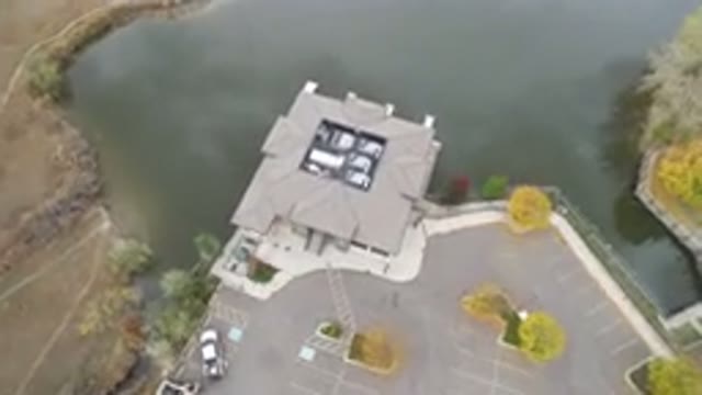 HIDDEN LAKE COLORADO-2016: Sea Near House With Parked Cars and Trees