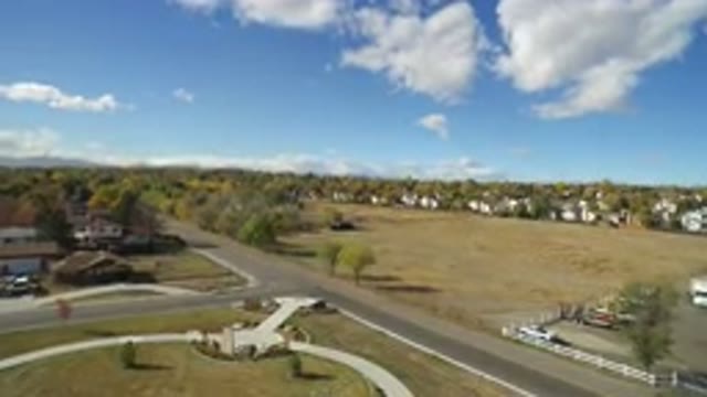 HIDDEN LAKE COLORADO-2016: Drone Filming A Landscape With Trees Fields And A
