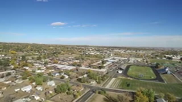 HIDDEN LAKE COLORADO-2016: Aerial View Panning Across Treed Suburbs And Grassy Fields