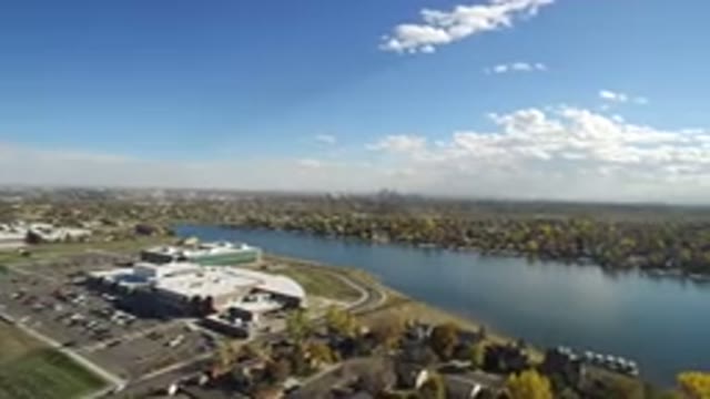 HIDDEN LAKE COLORADO-2016: Landscape View Of City With People Building And River