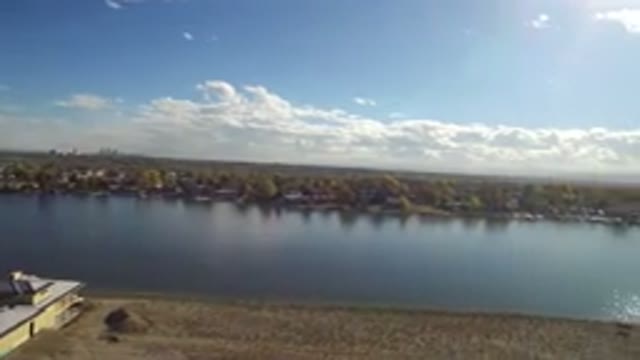 HIDDEN LAKE COLORADO-2016: Large Wide River With House On The Near Bank And