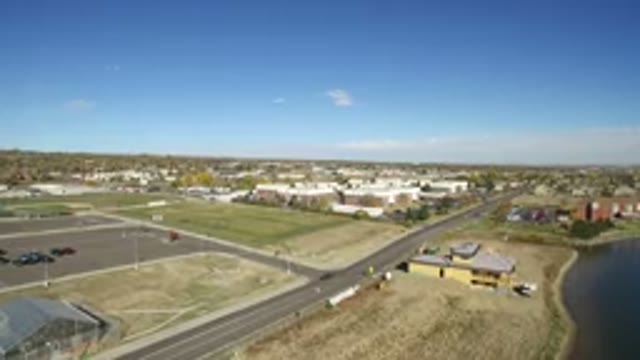 HIDDEN LAKE COLORADO-2016: Panoramic View Of A Sunny Coastal Town With Cars