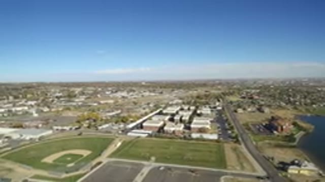 HIDDEN LAKE COLORADO-2016: Camera Panning Over Industrial Zone With Green Trees