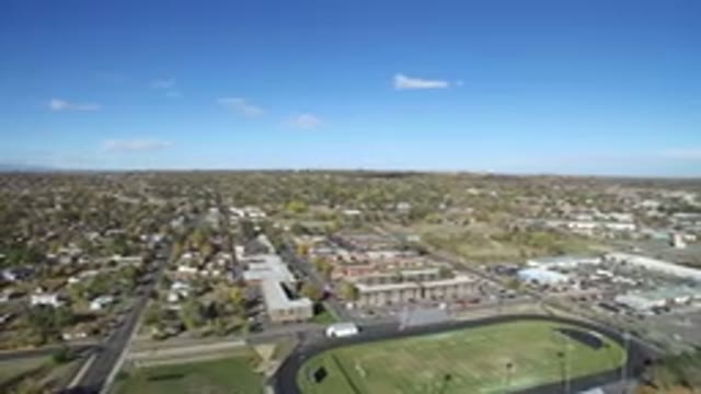 HIDDEN LAKE COLORADO-2016: Flyover Suburban School Football Field And Track On A