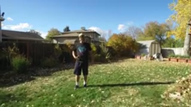 HIDDEN LAKE COLORADO-2016: Man in T-Shirt and Hat Watches Drone Land in the Backyard