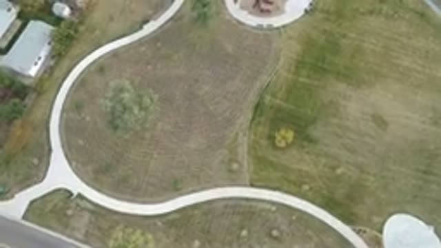 HIDDEN LAKE COLORADO-2016: Aerial View Aboard a Helicopter of a Winding White Road