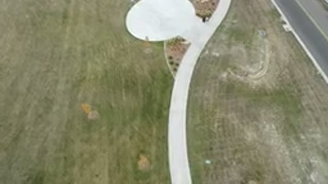 HIDDEN LAKE COLORADO-2016: Camera Zooming Out Of A View With A Road And A Green