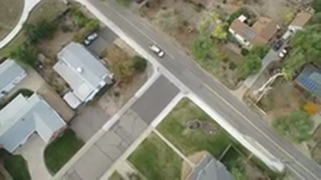 HIDDEN LAKE COLORADO-2016: Bird's Eye View Of A Car Moving On A Road Between