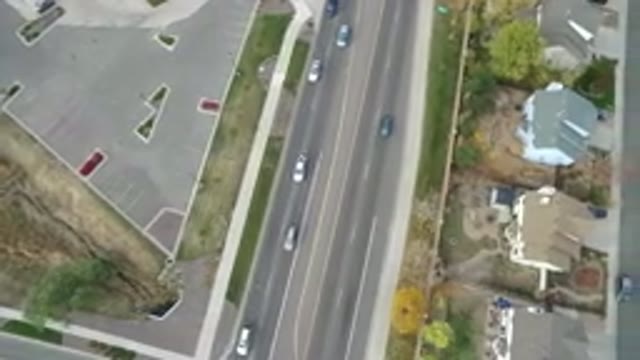 HIDDEN LAKE COLORADO-2016: Busy Highway Surrounded By A Parking Lot And A