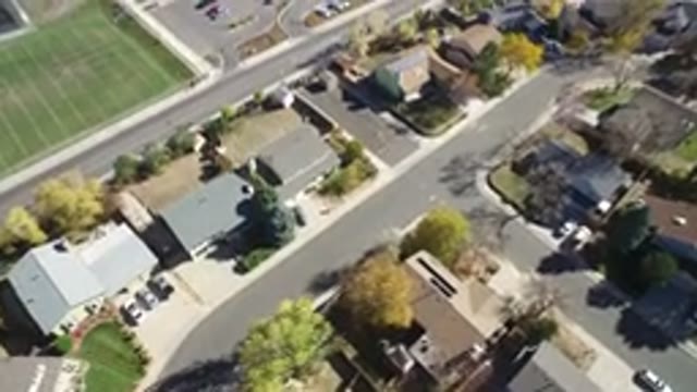 HIDDEN LAKE COLORADO-2016: A Drone Flying Over a Cluster of Buildings in Summer