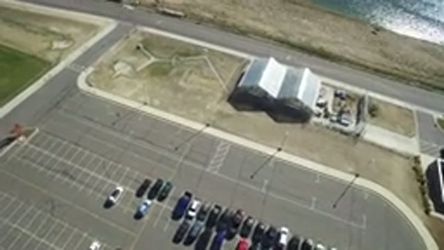 HIDDEN LAKE COLORADO-2016: Half Full Parking Lot And Road Next To A Lake On A