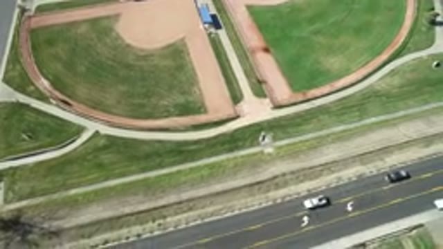 HIDDEN LAKE COLORADO-2016: Aerial View Of Cars Driving On The Highway Next To A