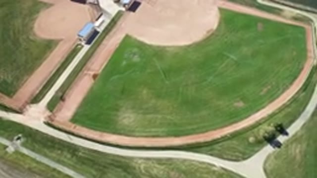 HIDDEN LAKE COLORADO-2016: Aerial View Over Grassy Baseball Field Bordered By A