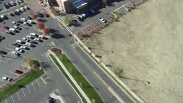 HIDDEN LAKE COLORADO-2016: Aerial View Of A Big Parking Lot Next To Some Buildings