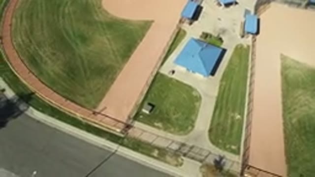 HIDDEN LAKE COLORADO-2016: Top View Of A Field With A House In The Center And A