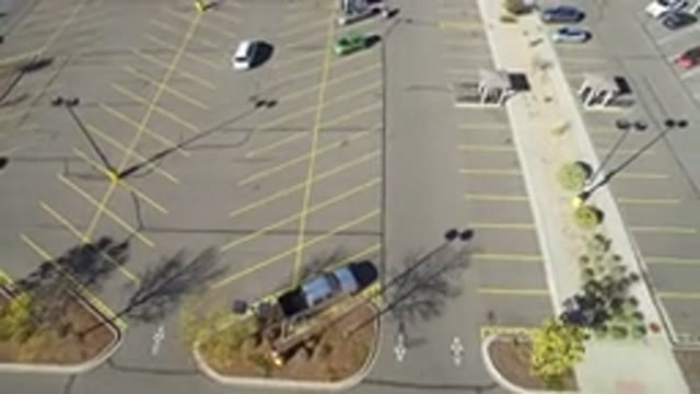 HIDDEN LAKE COLORADO-2016: Overhead View Of Large Parking Lot With Cars Stopped