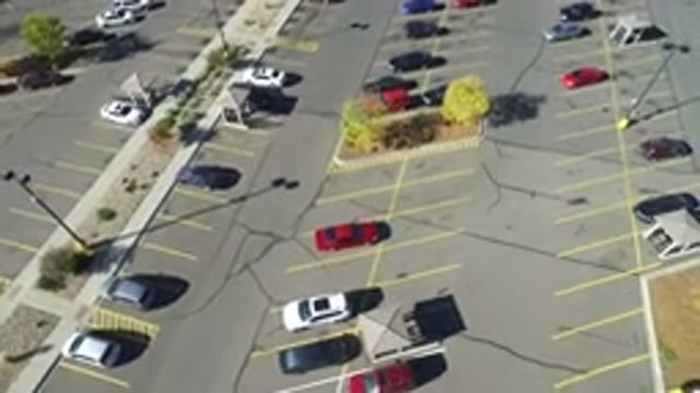 HIDDEN LAKE COLORADO-2016: Aerial View Panning Across A Large Partially Full Car Lot