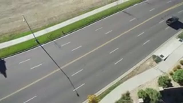 HIDDEN LAKE COLORADO-2016: Two Cars Driving On Road During Day But No People