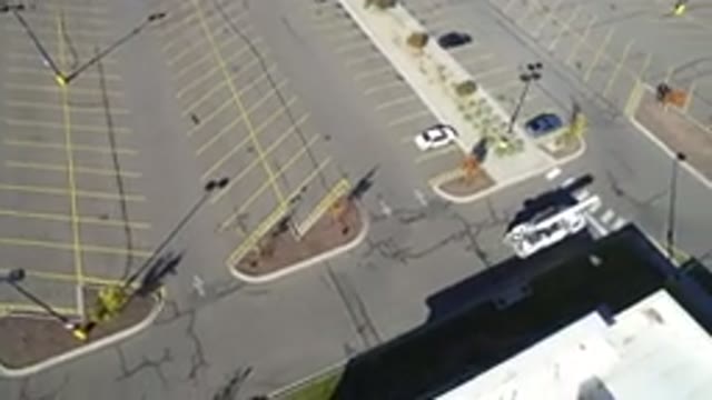 HIDDEN LAKE COLORADO-2016: Construction Truck Slowly Driving Out In Empty Parking Lot