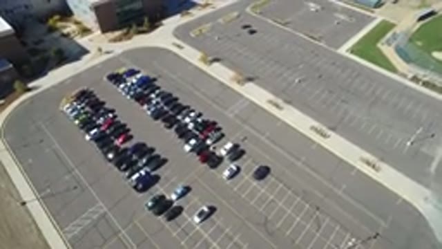 HIDDEN LAKE COLORADO-2016: Aerial Drone Footage Of A Parking Lot Half Full Of Cars
