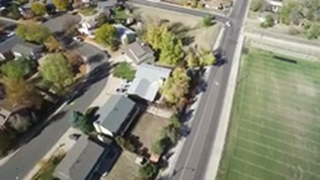 HIDDEN LAKE COLORADO-2016: Camera On Drone Recording Video Of City With Houses