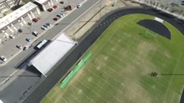 HIDDEN LAKE COLORADO-2016: Drone Footage Of A Football Field With A Runner