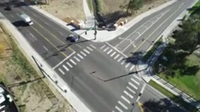 HIDDEN LAKE COLORADO-2016: A Busy Intersection Of Two Roads With Trucks And Cars