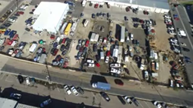 HIDDEN LAKE COLORADO-2016: View Of A Junk Yard With Nearby Traffic