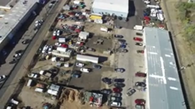 HIDDEN LAKE COLORADO-2016: Aerial Video Of A Large Building With A Crowded Parking Lot