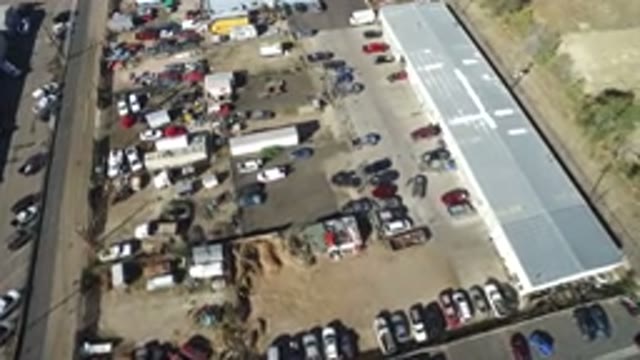 HIDDEN LAKE COLORADO-2016: Aerial View Over Junkyard And Building Complex With