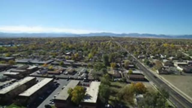 HIDDEN LAKE COLORADO-2016: Camera Panning Over Neighborhood With Green Trees And