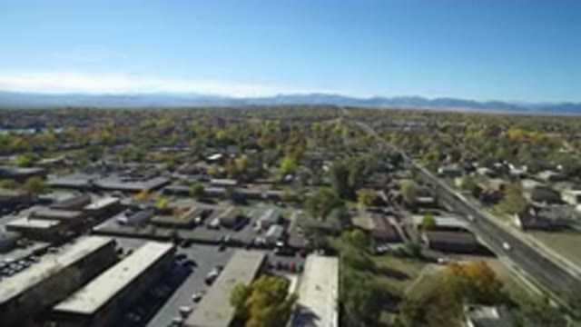 HIDDEN LAKE COLORADO-2016: Drone Image Of A Very Busy City With Lots Of Trees In