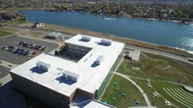 HIDDEN LAKE COLORADO-2016: A Car Passing Through A Road Next To A Big Building