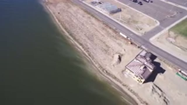 HIDDEN LAKE COLORADO-2016: Yellow House With Pitched Roof By The Seaside With