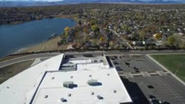 HIDDEN LAKE COLORADO-2016: Top View Of A Factory With A City Full Of Trees And