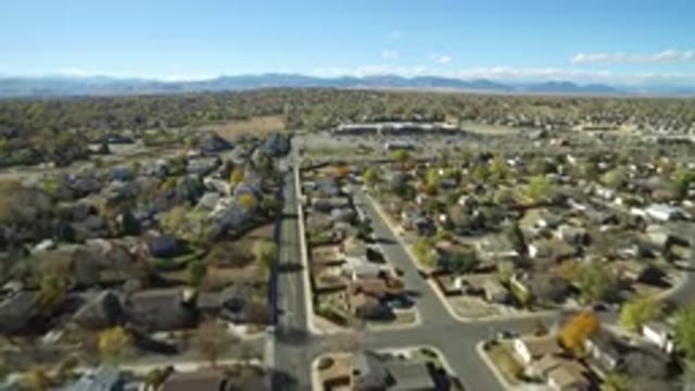 HIDDEN LAKE COLORADO-2016: Lazy Suburban Streets with Cars Zooming On A