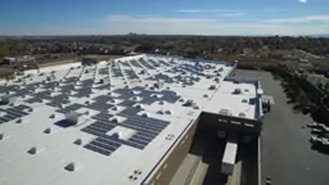 HIDDEN LAKE COLORADO-2016: Panoramic Drone Shot Of Building With Solar Panels