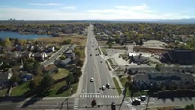 HIDDEN LAKE COLORADO-2016: Busy Day Cars Driving Through Houses Near Lake