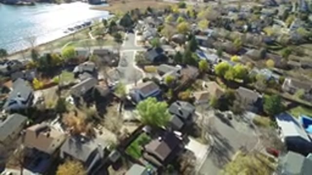 HIDDEN LAKE COLORADO-2016: Group of Houses Beside a Lake With Vehicles